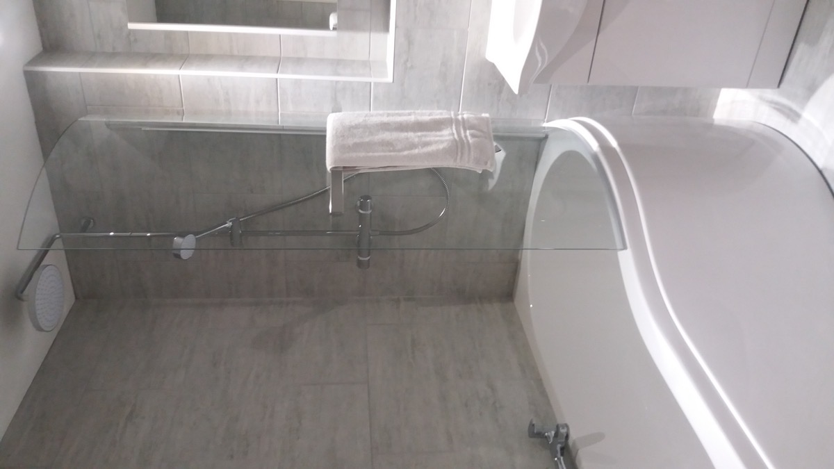 Tiled bathroom with shower enclosure