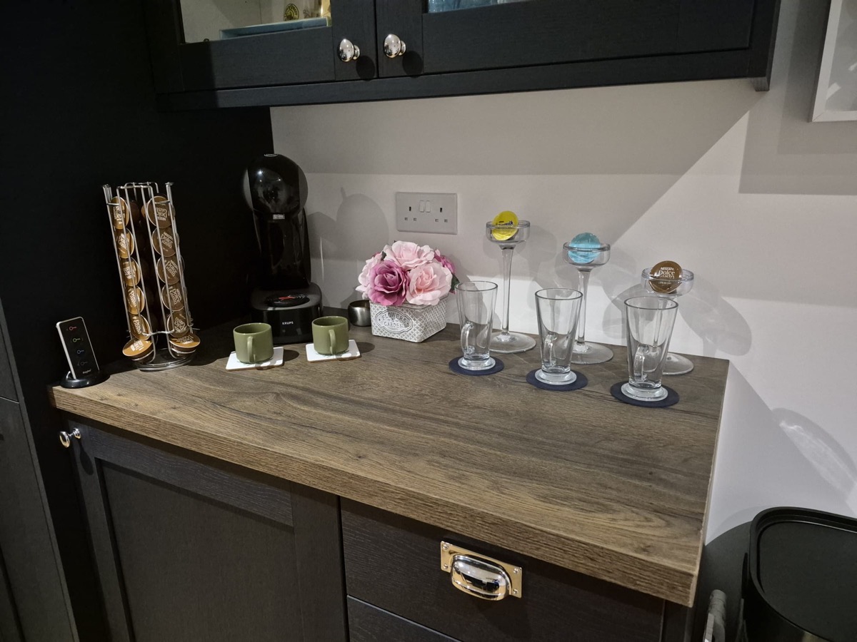 Bespoke navy drinks and coffee station with fitted cabinets
