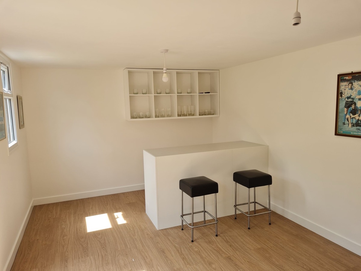 Custom built home bar with shelving