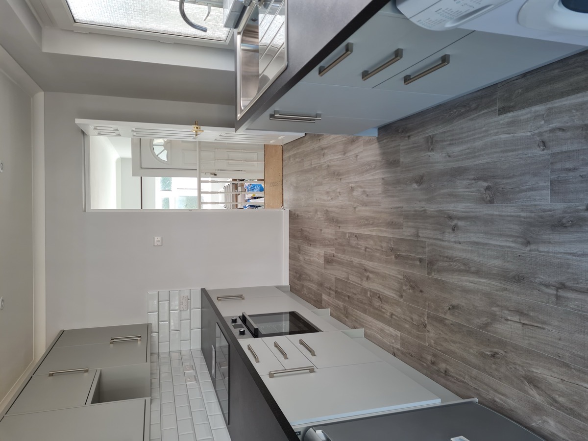 Grey shaker kitchen with island and pendant lights