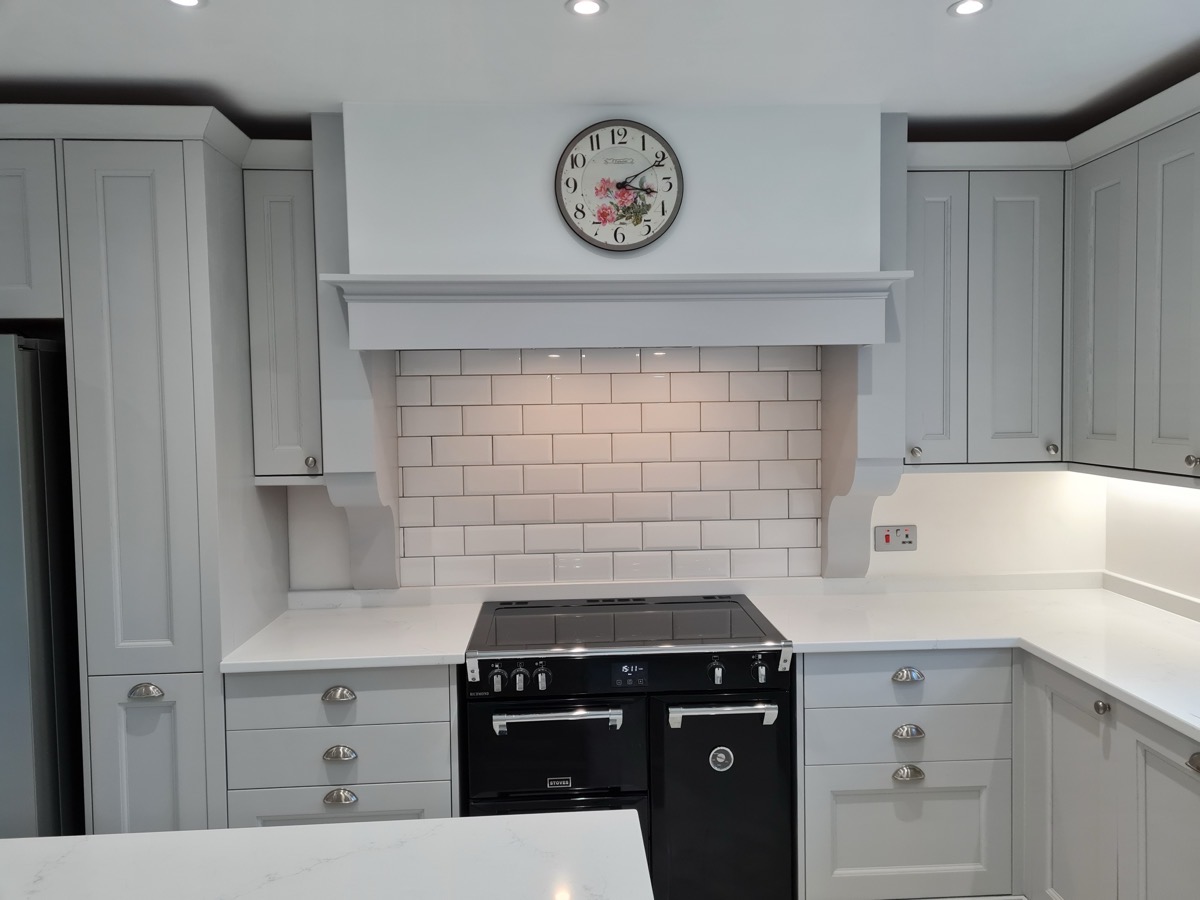 Grey shaker kitchen with large island and marble worktops