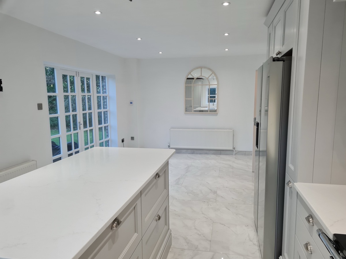 Grey shaker kitchen wide view with marble floor