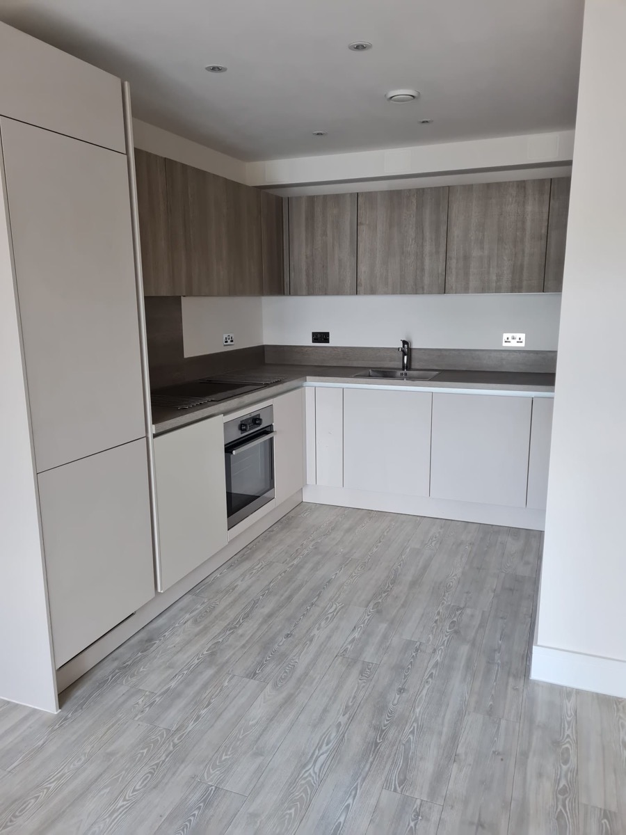 Handleless modern kitchen in white and wood grain