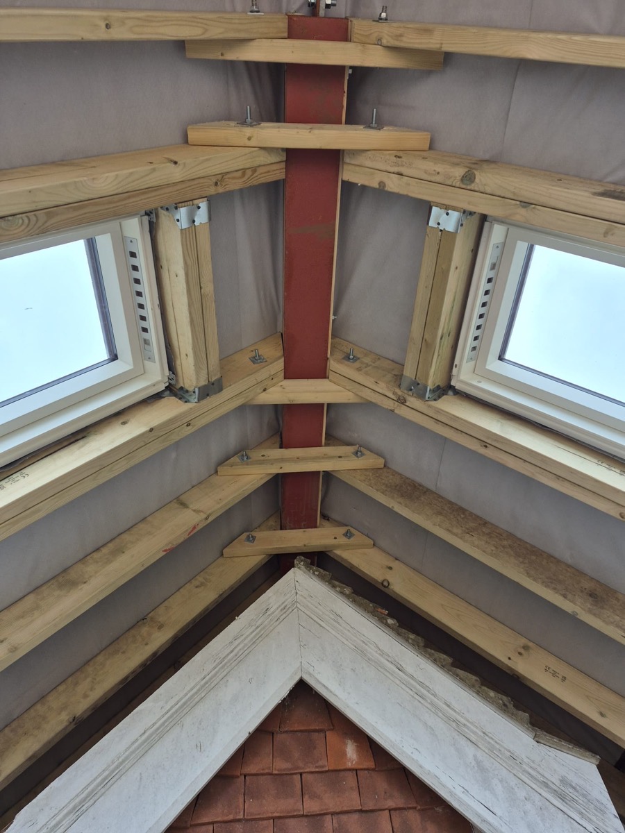 Roof structure with twin skylights and steel beam
