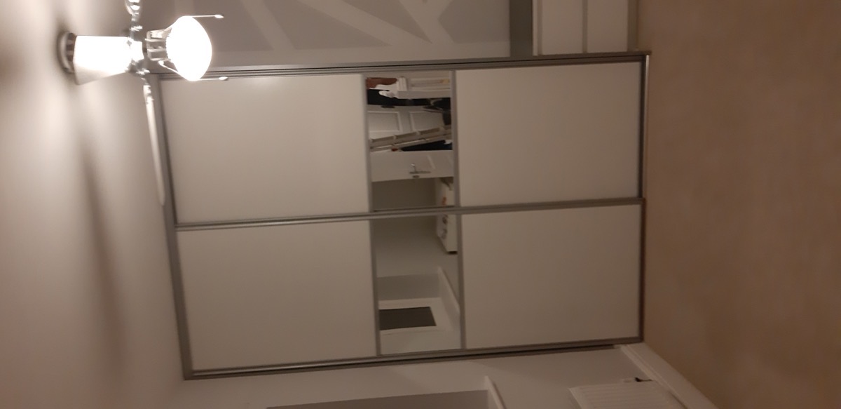 Fitted wardrobe with mirror doors